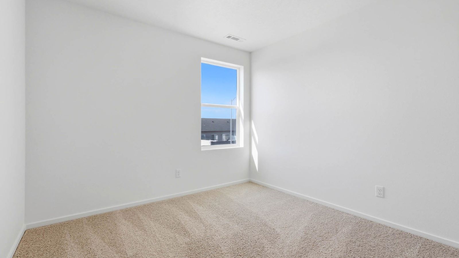 Bedroom with wall-to-wall carpet and a closet