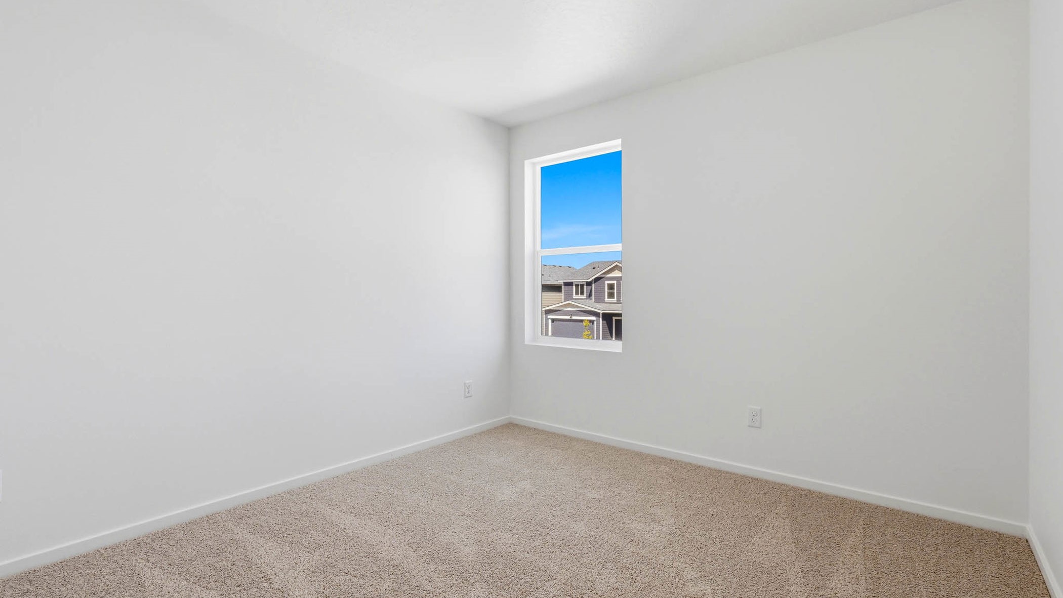 Bedroom with wall-to-wall carpet and a closet