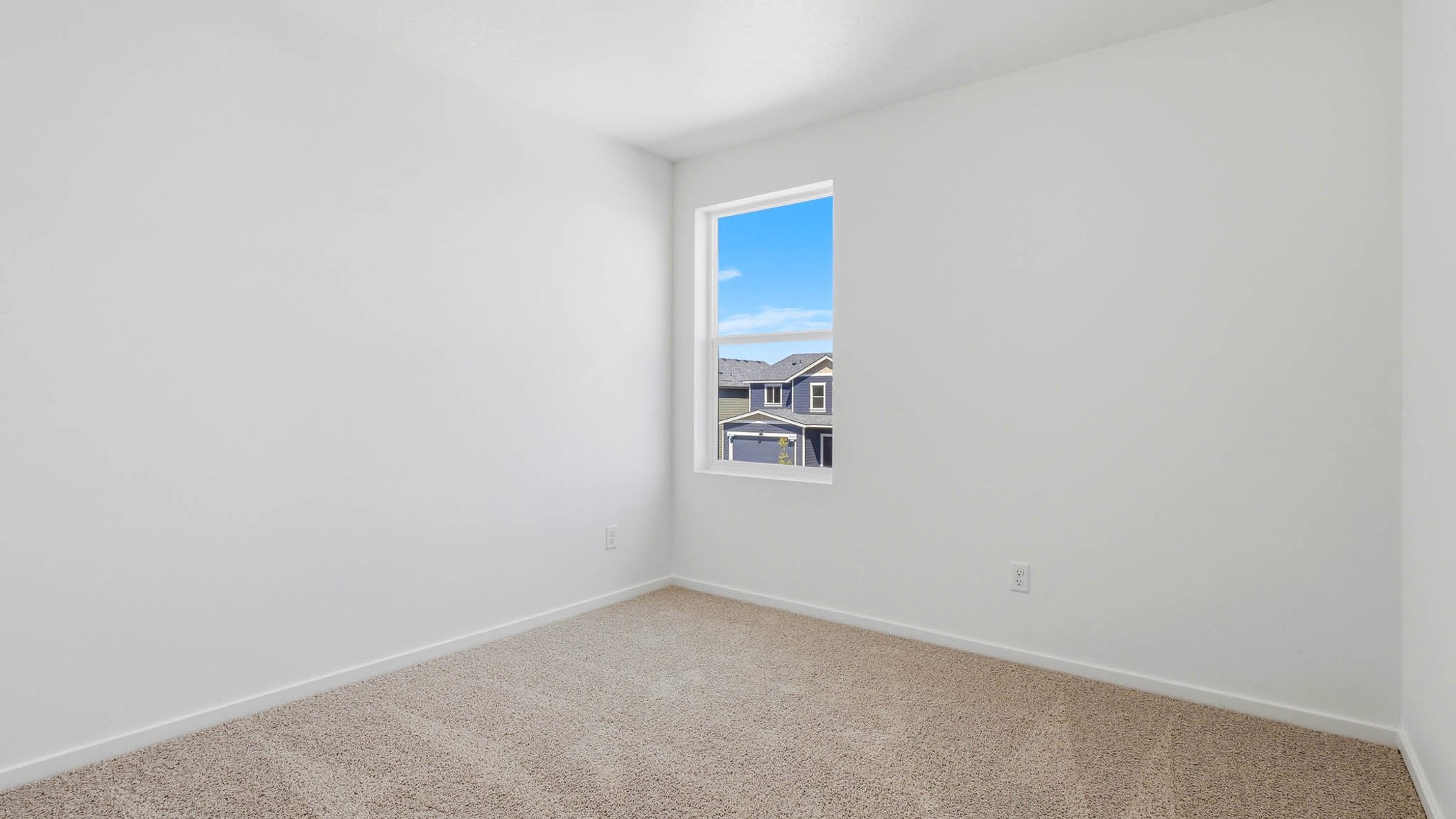 Bedroom with wall-to-wall carpet and a closet
