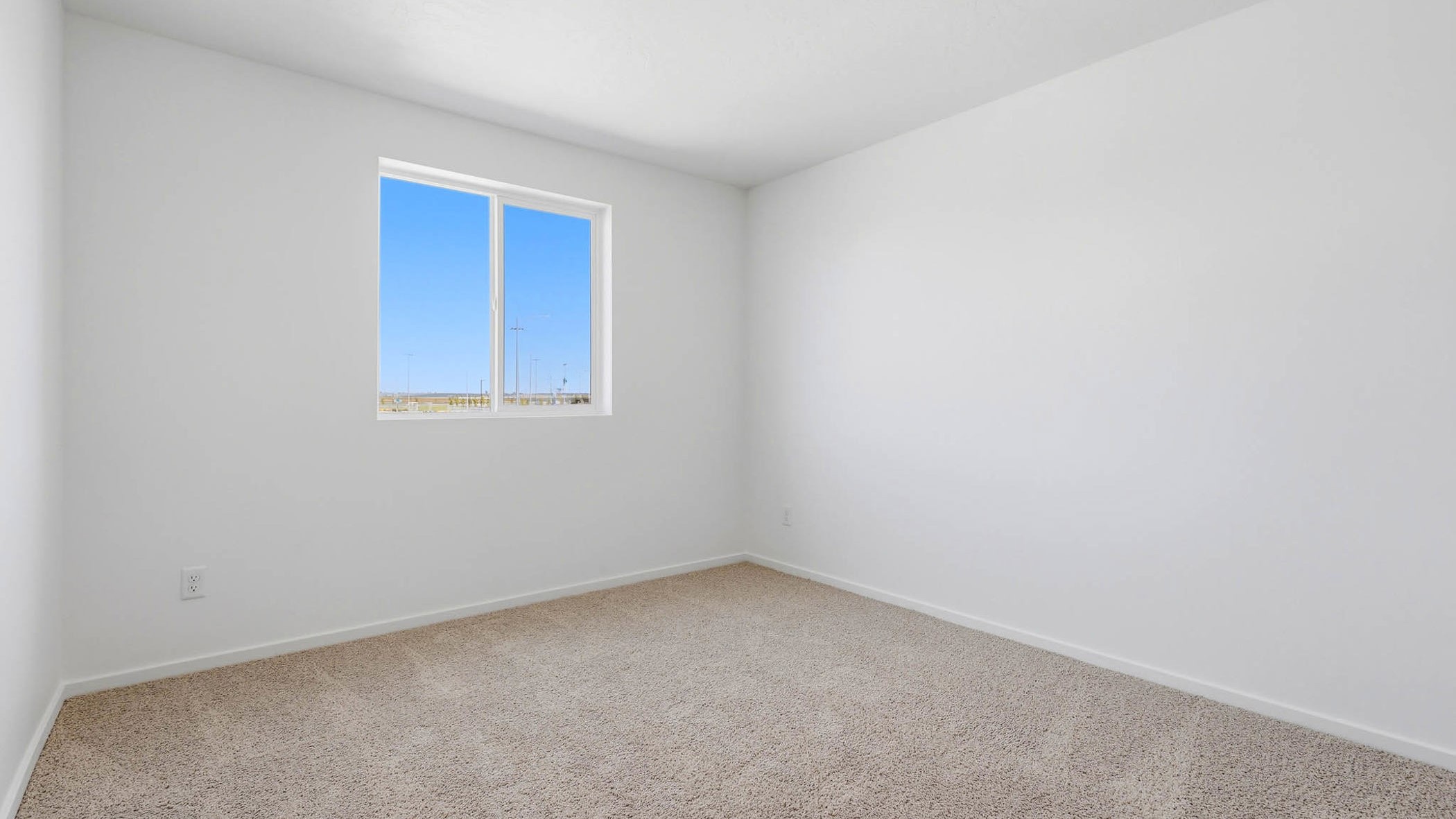 Bedroom with wall-to-wall carpet and a closet