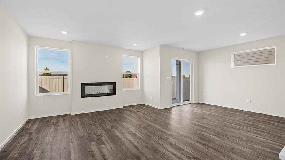 Great room with laminate flooring and an electric fireplace