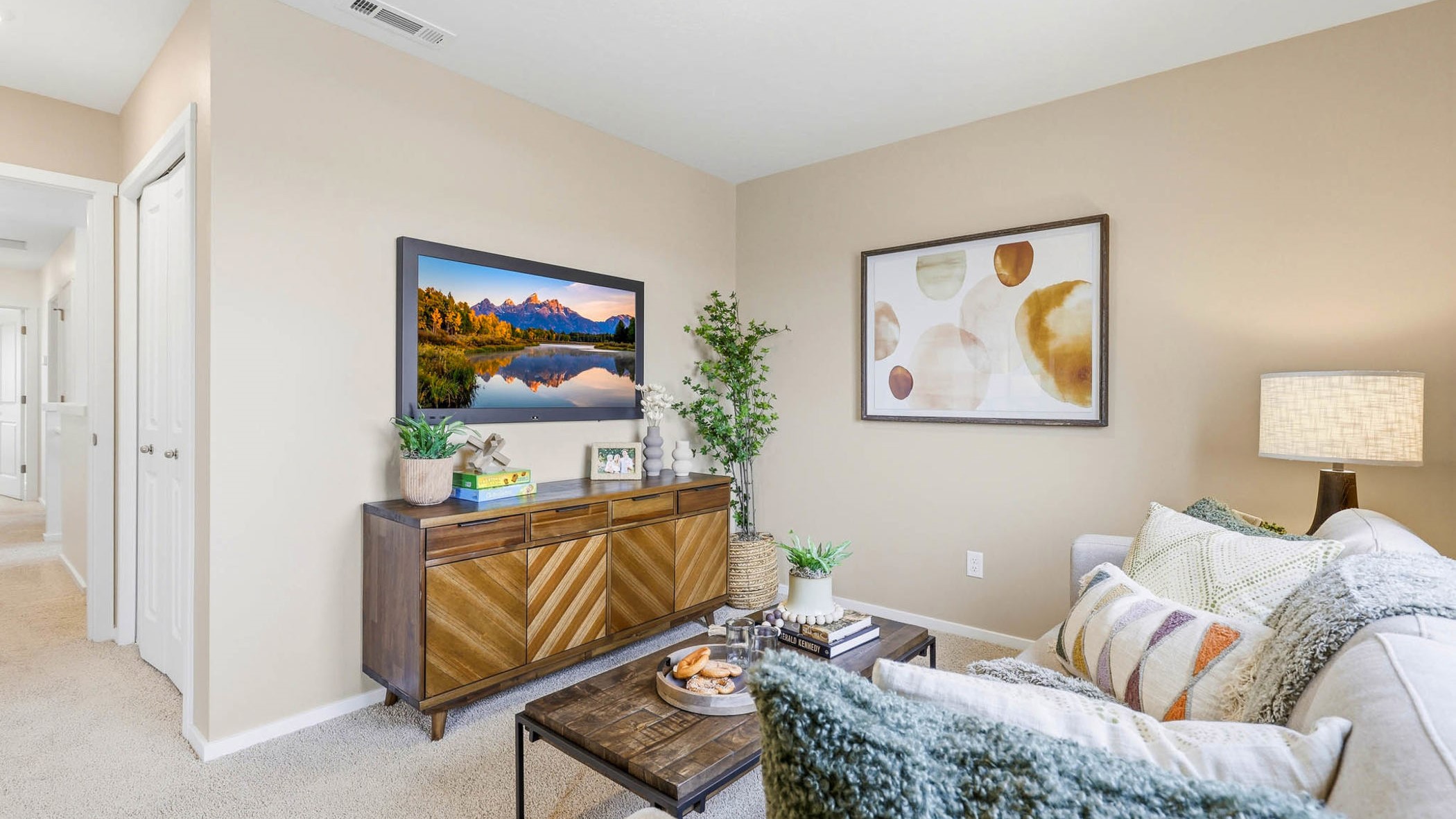 Bedroom with wall-to-wall carpet and a closet