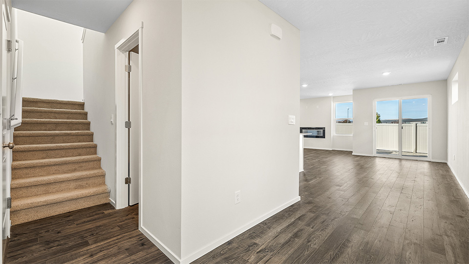 Entryway with a coat closet and laminate flooring