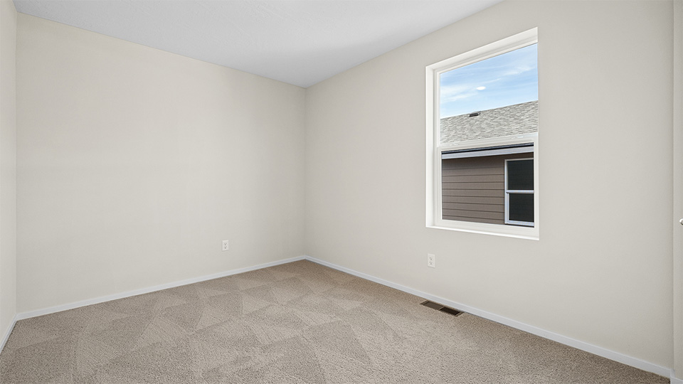 Bedroom with wall-to-wall carpet and a closet