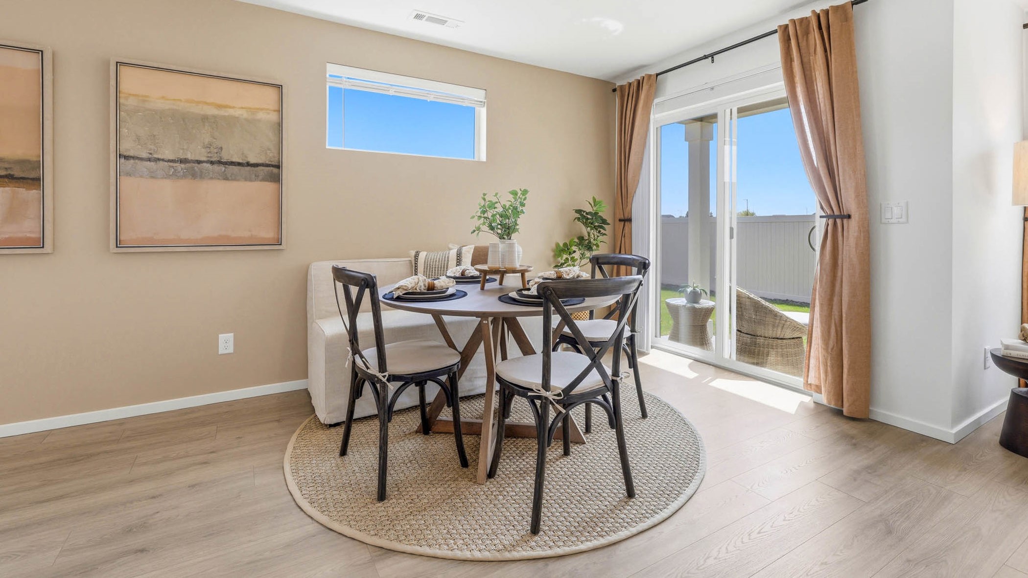 Dining area with a sliding glass door to a fenced backyard