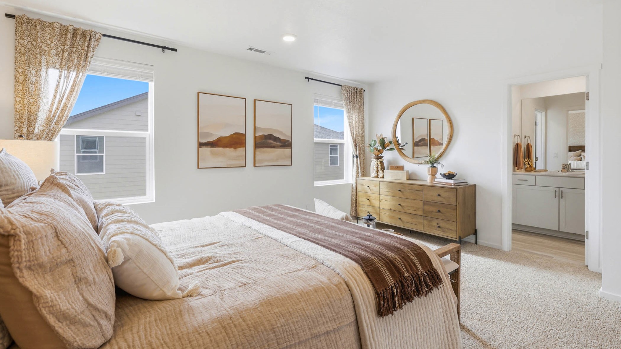 Primary bedroom with wall-to-wall carpet, a walk-in closet and an attached bathroom