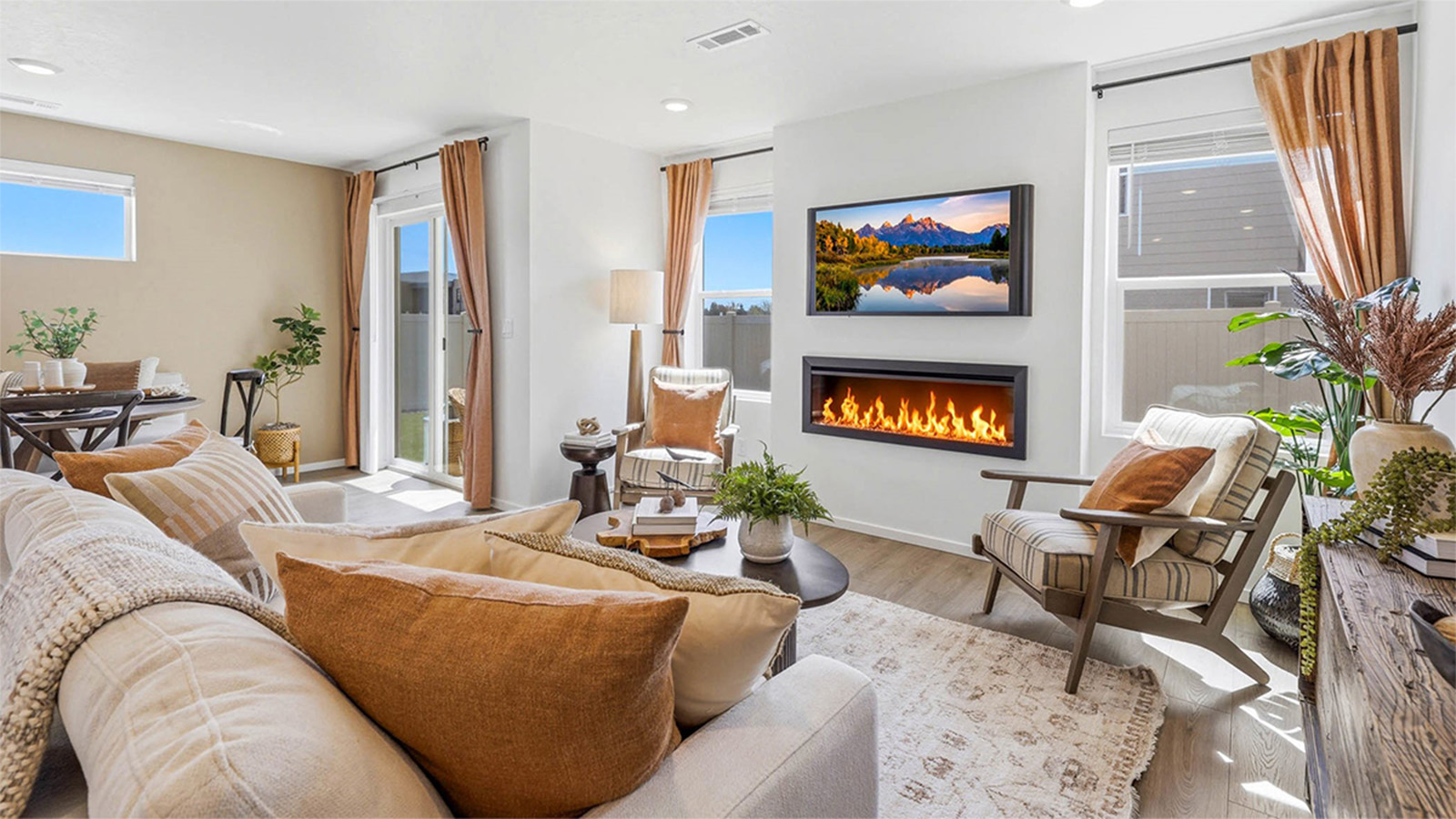 Great room with laminate flooring and an electric fireplace