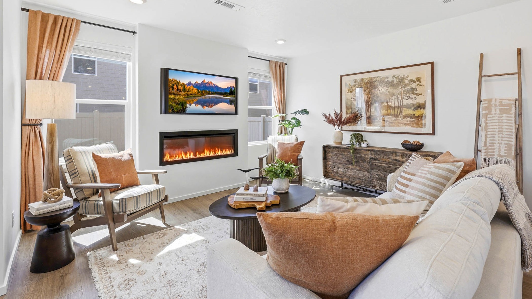 Great room with laminate flooring and an electric fireplace