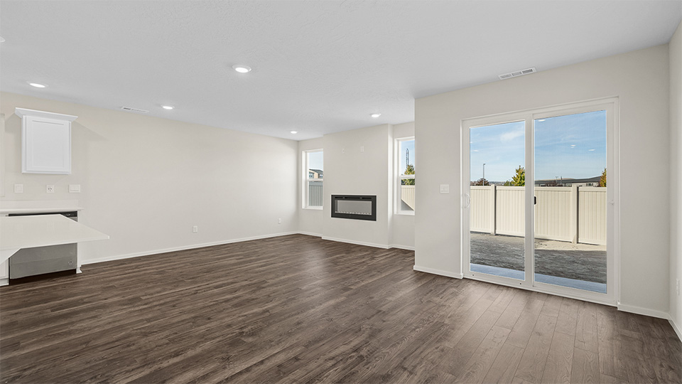 Great room with laminate flooring and an electric fireplace