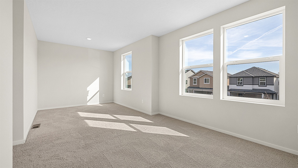 Bedroom with wall-to-wall carpet and a closet