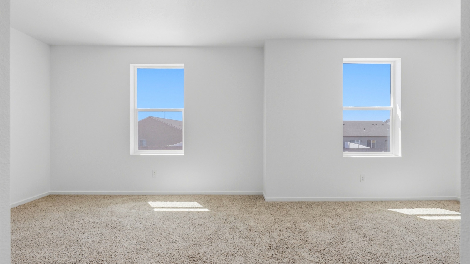 Bedroom with wall-to-wall carpet and a closet