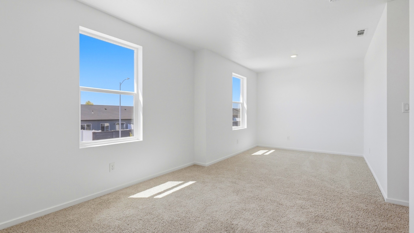 Bedroom with wall-to-wall carpet and a closet