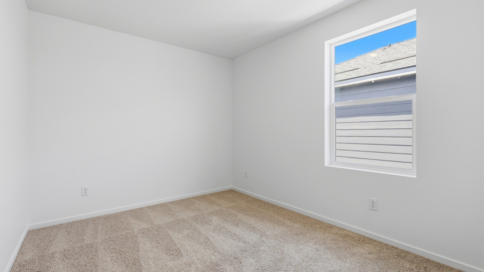 Bedroom with wall-to-wall carpet and a closet