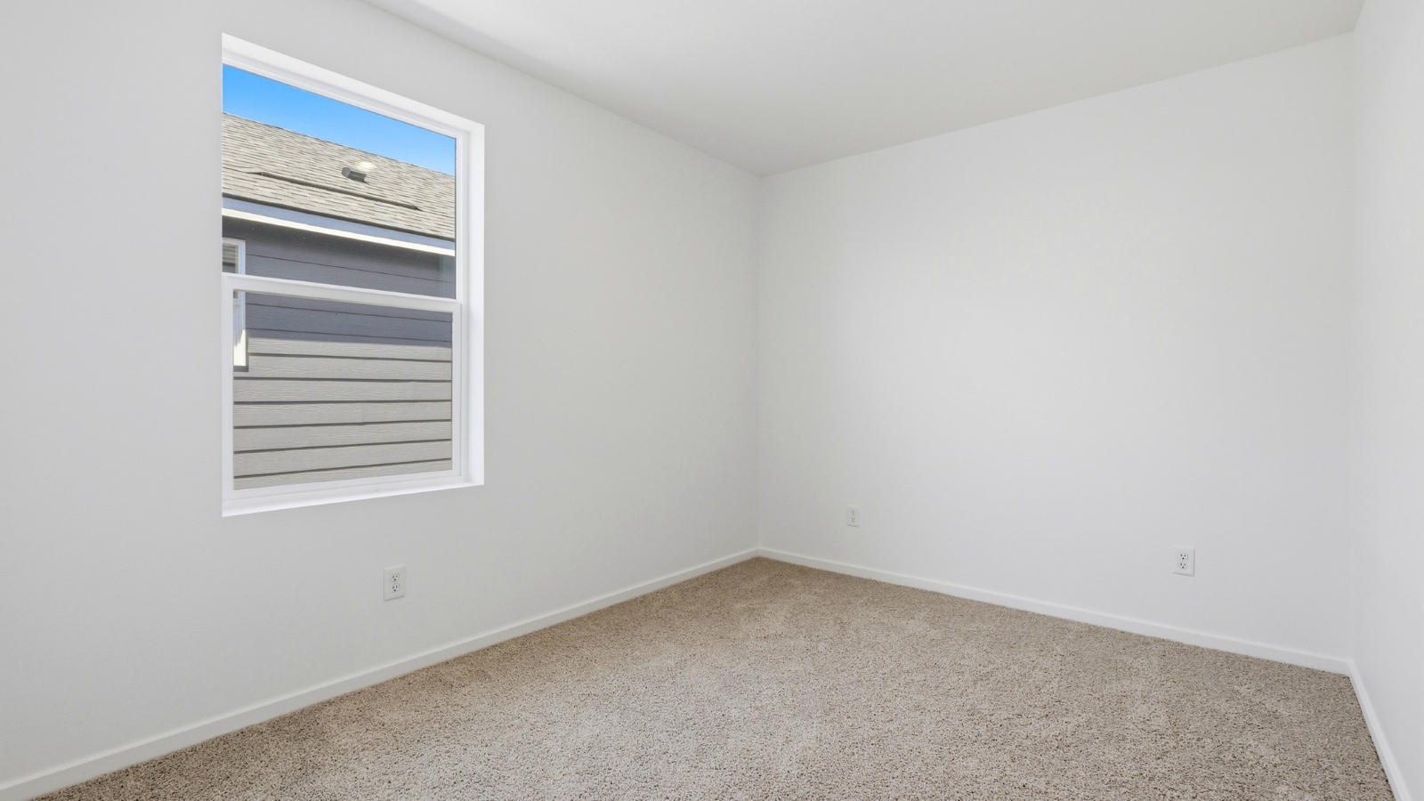 Bedroom with wall-to-wall carpet and a closet