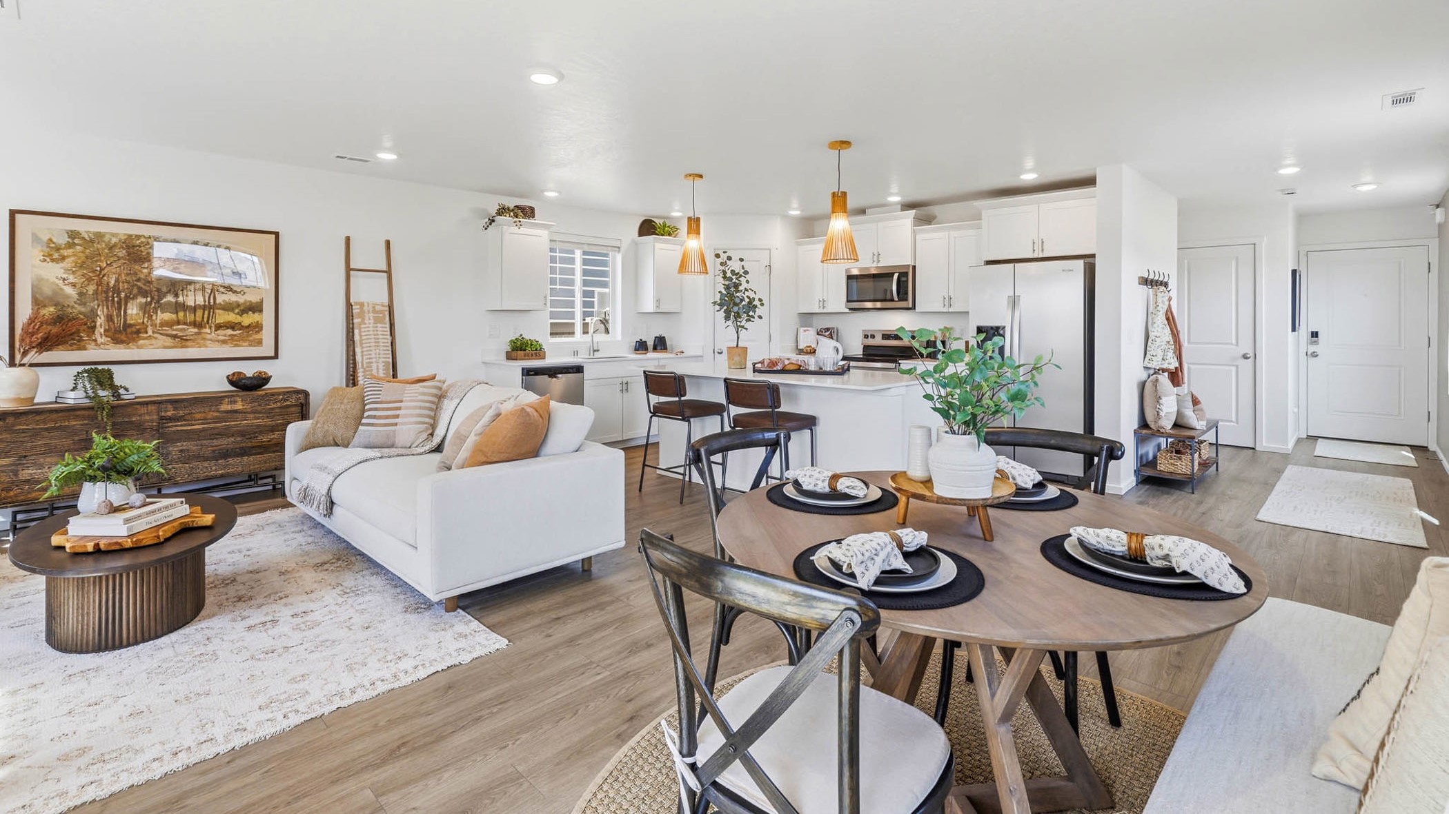 Great room with laminate flooring and an electric fireplace