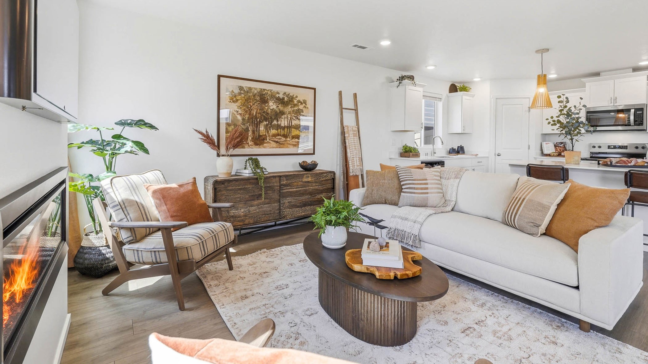 Great room with laminate flooring and an electric fireplace