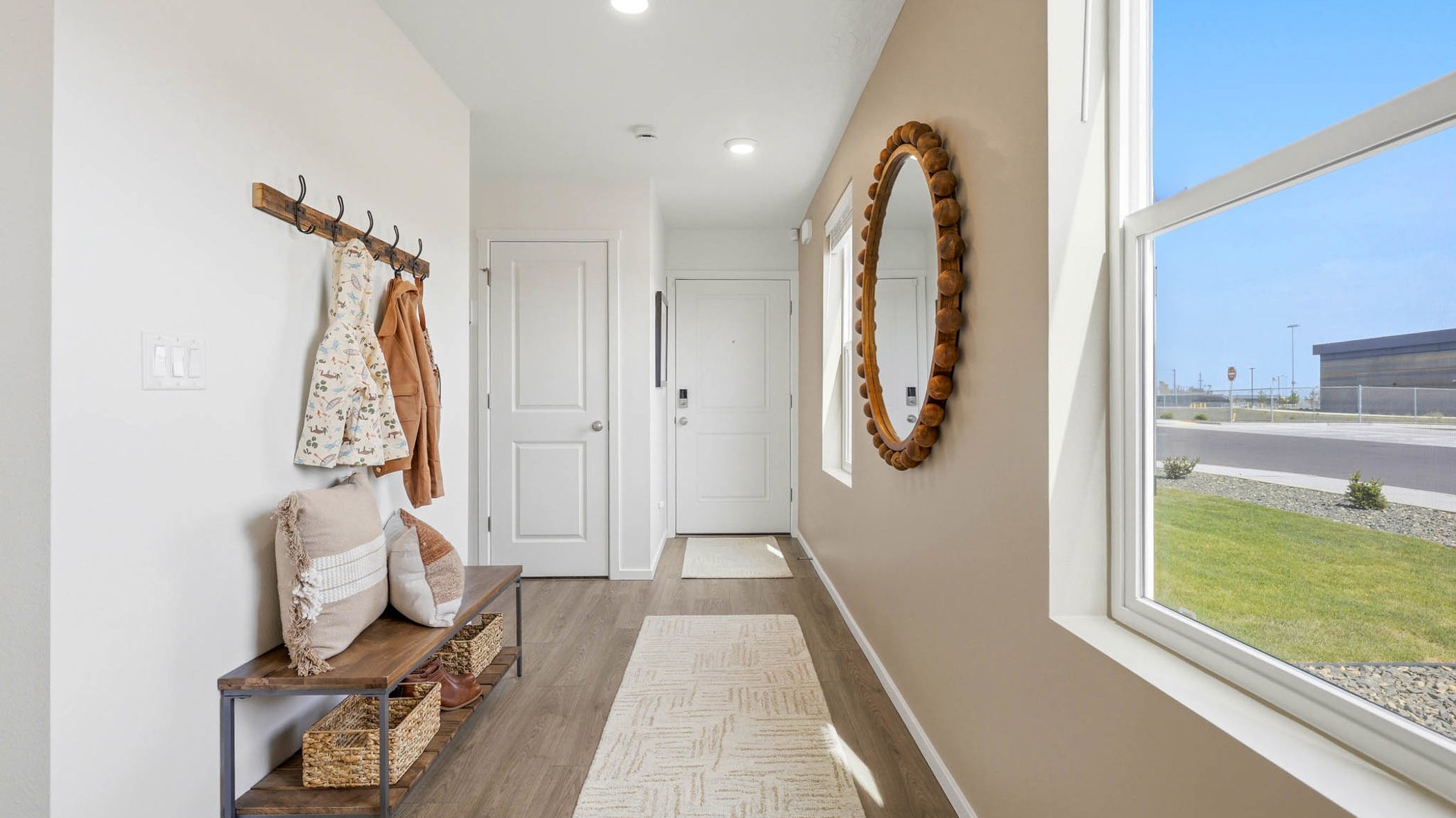 Entryway with a coat closet and laminate flooring