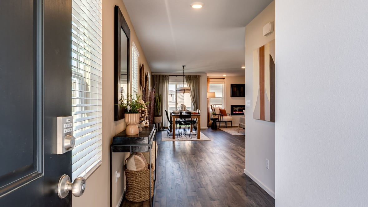 Entryway with a coat closet and laminate flooring