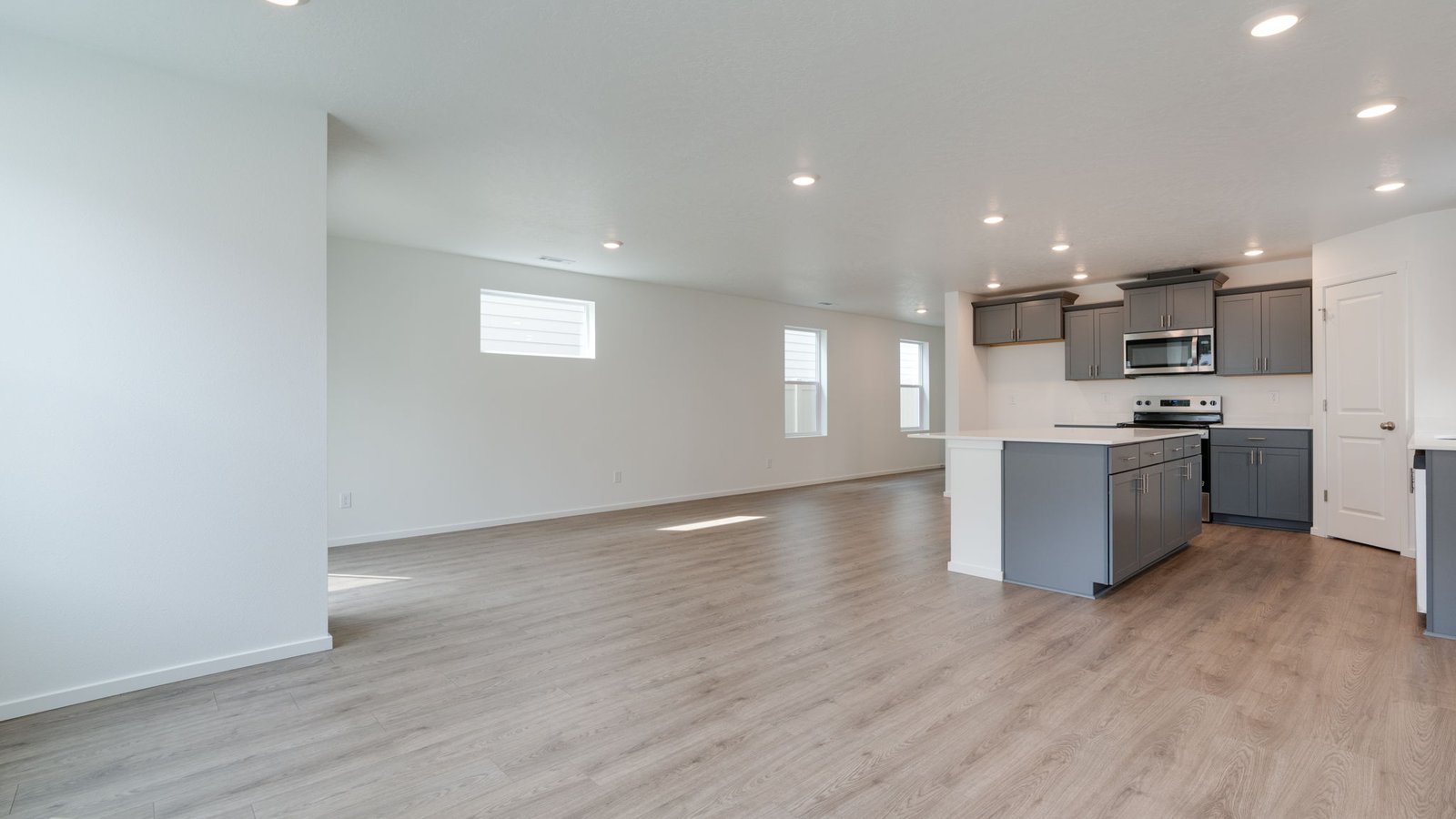 Great room with laminate flooring and an electric fireplace