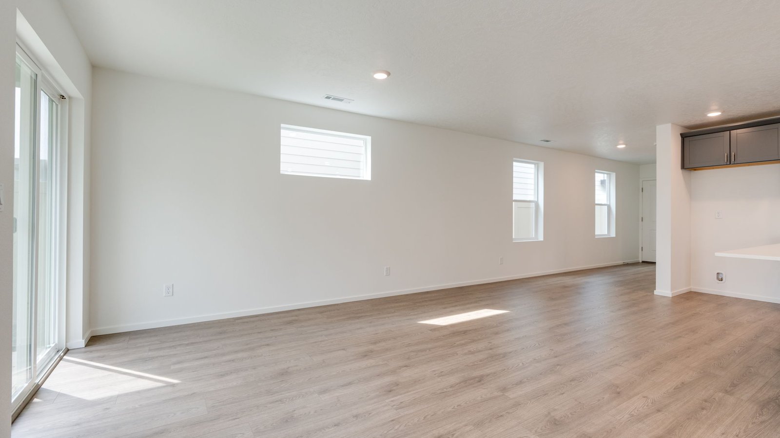 Great room with laminate flooring and an electric fireplace