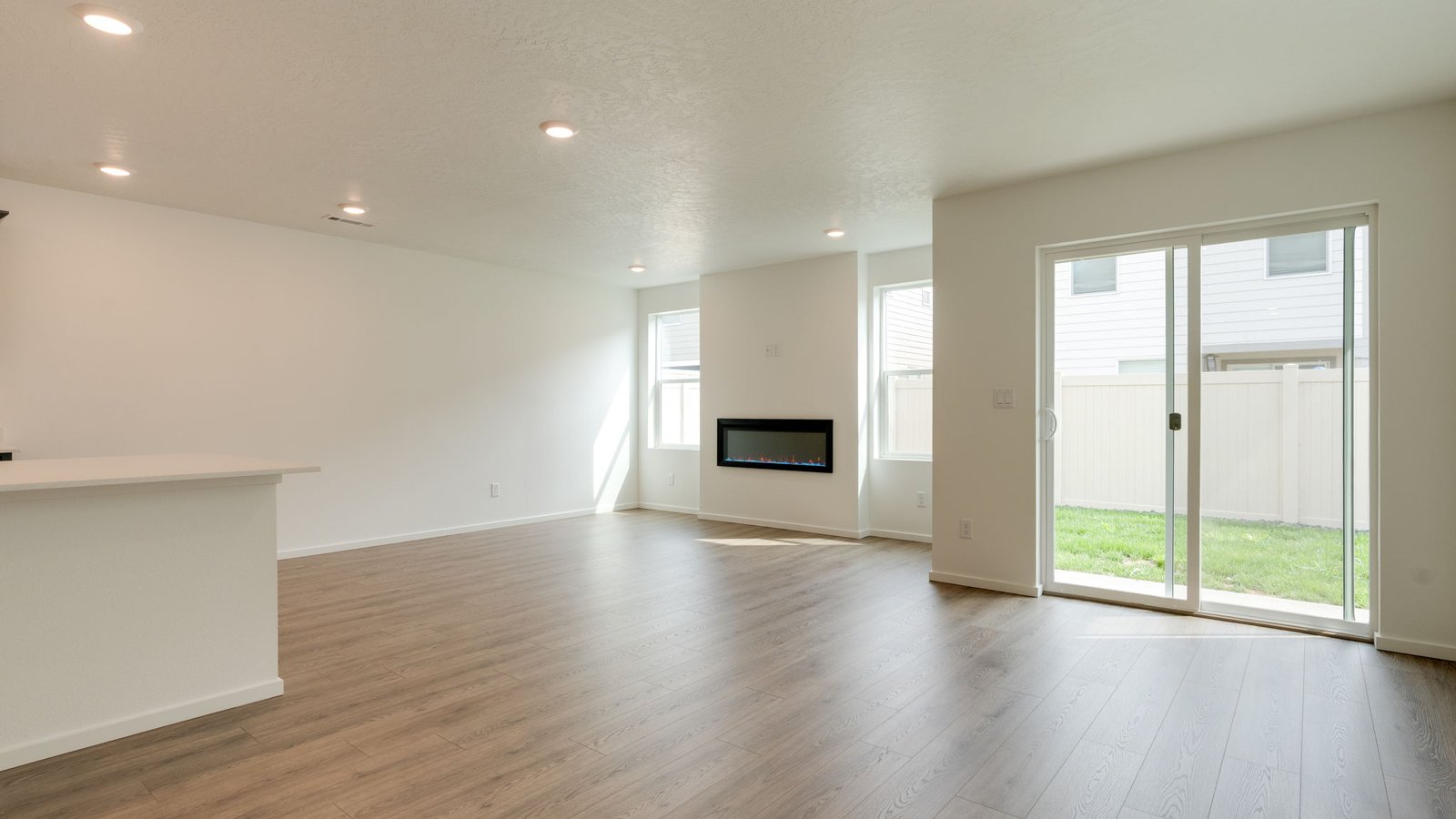 Dining area with a sliding glass door to a fenced backyard