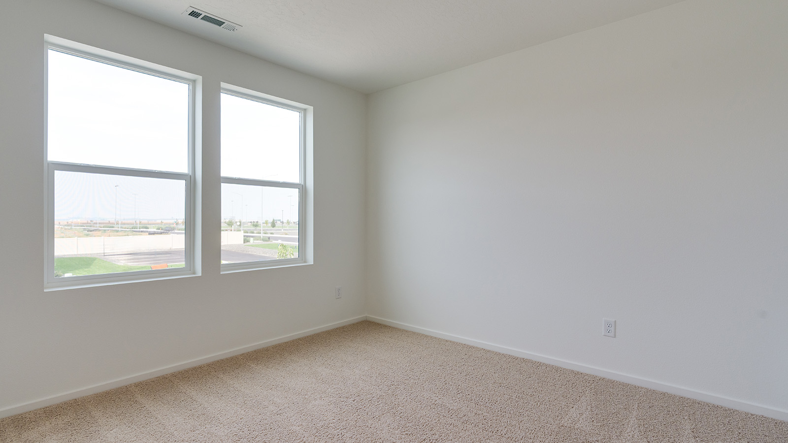Bedroom with wall-to-wall carpet and a closet