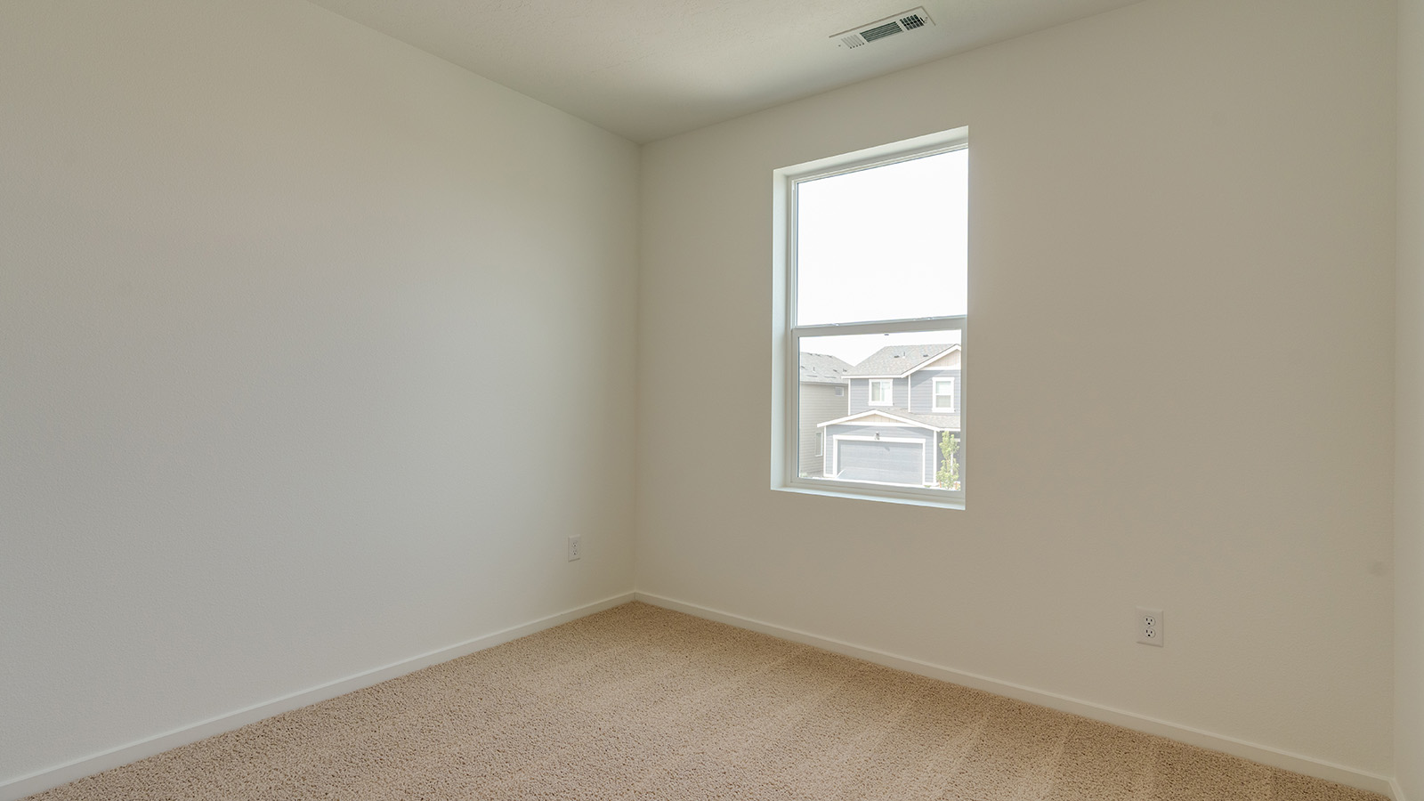 Bedroom with wall-to-wall carpet and a closet
