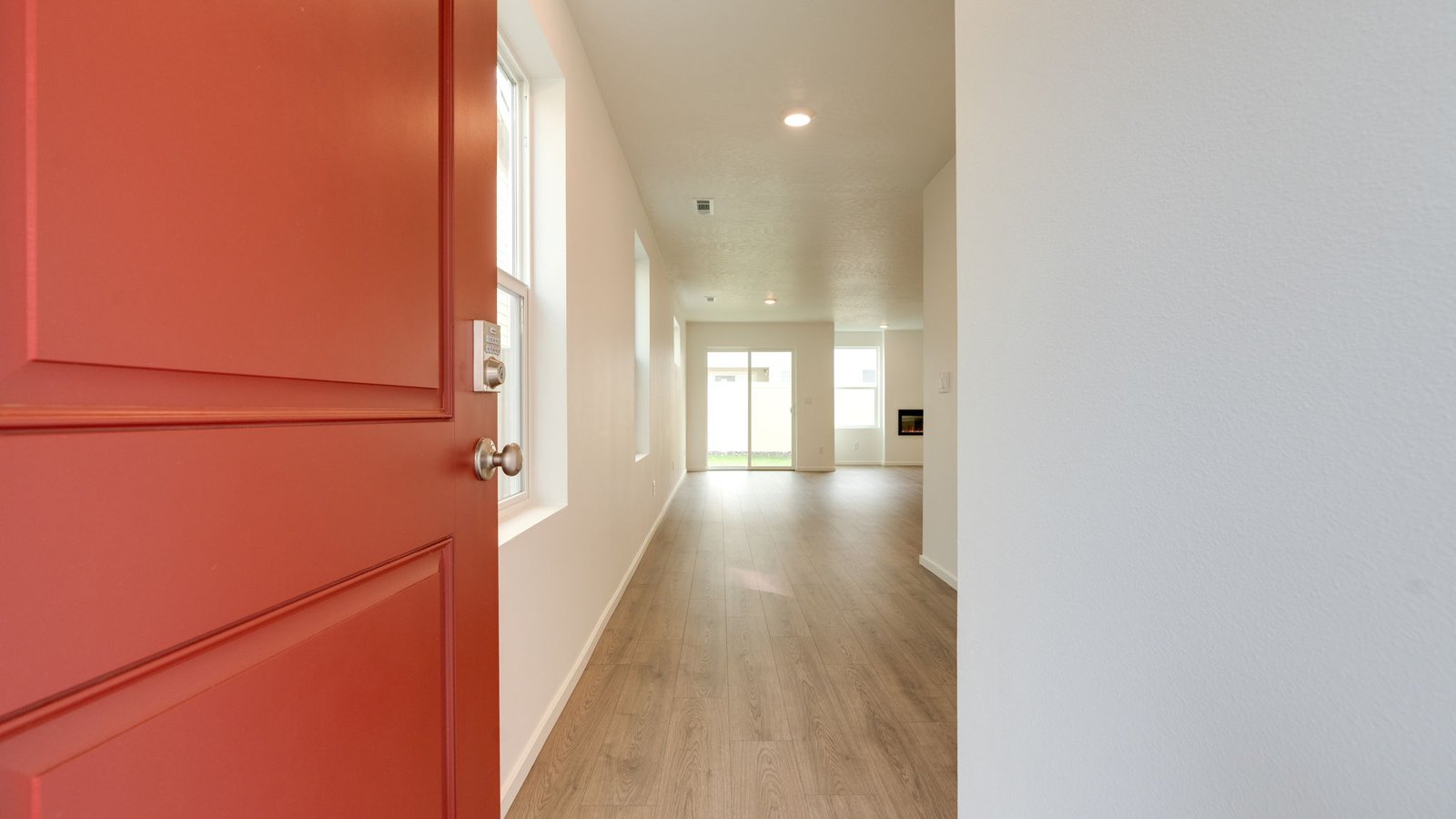 Entryway with a coat closet and laminate flooring