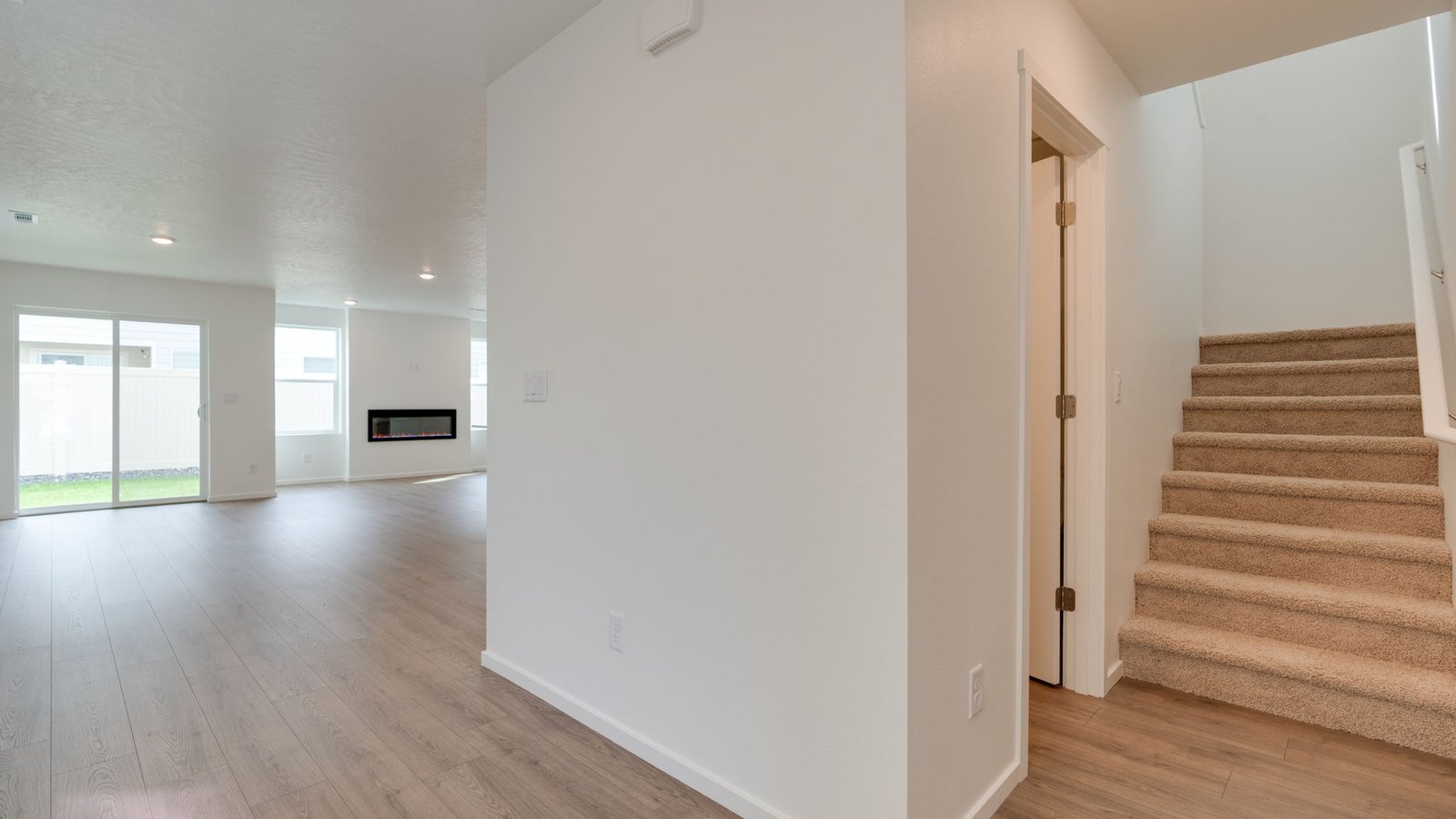 Entryway with a coat closet and laminate flooring