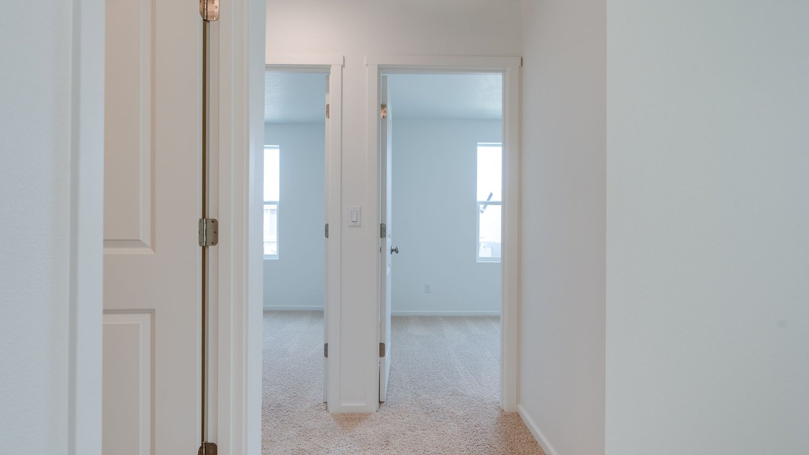 Hallway with wall-to-wall carpet