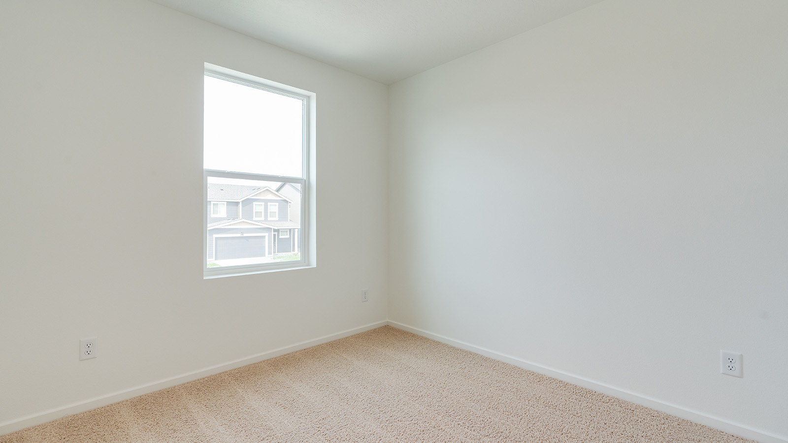 Bedroom with wall-to-wall carpet and a closet