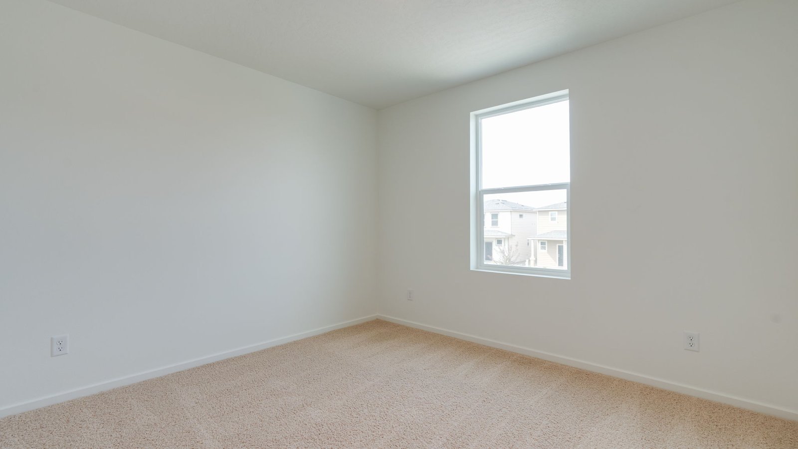Bedroom with wall-to-wall carpet and a closet