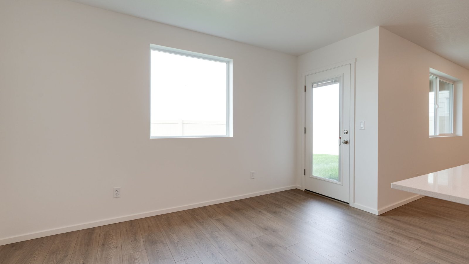 Dining area with a sliding glass door to a fenced backyard
