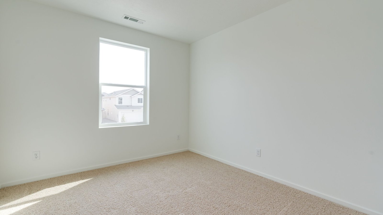 Bedroom with wall-to-wall carpet and a closet