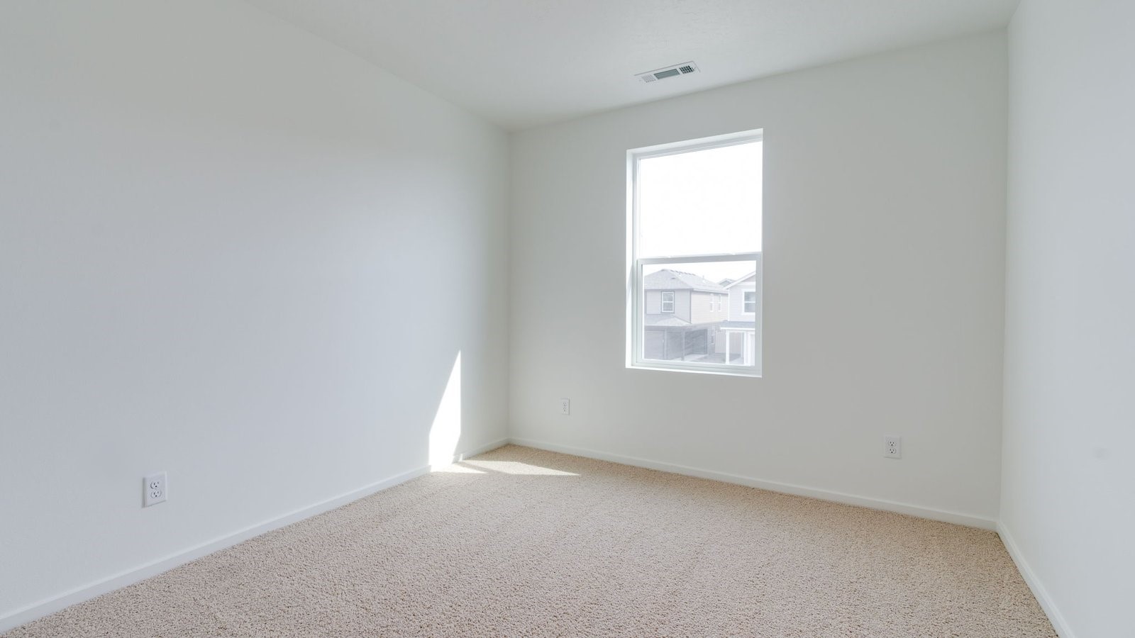 Bedroom with wall-to-wall carpet and a closet