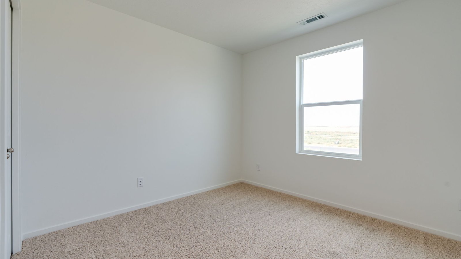 Bedroom with wall-to-wall carpet and a closet