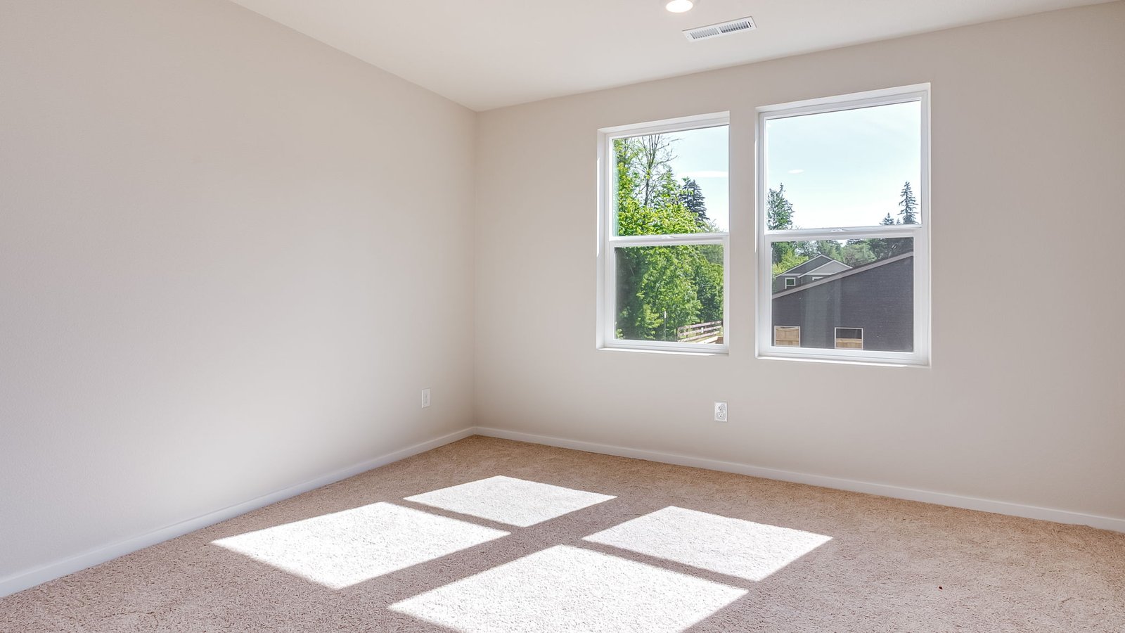 Primary bedroom with wall-to-wall carpet, a walk-in closet and an attached bathroom