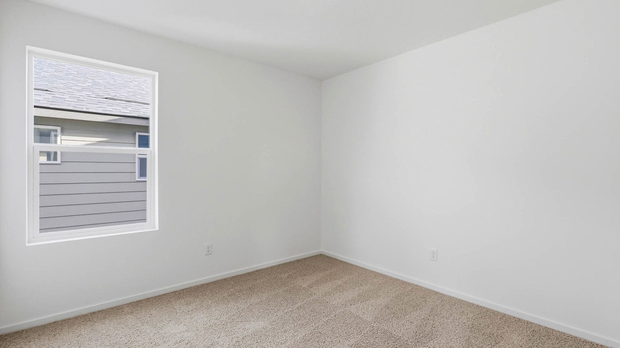 Bedroom with wall-to-wall carpet and a closet