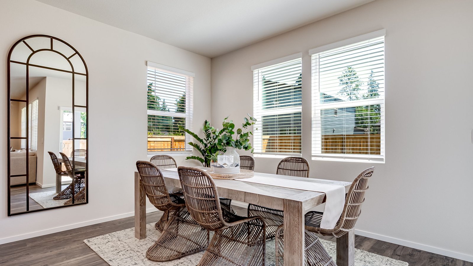 Dining area with a sliding glass door to a fenced backyard