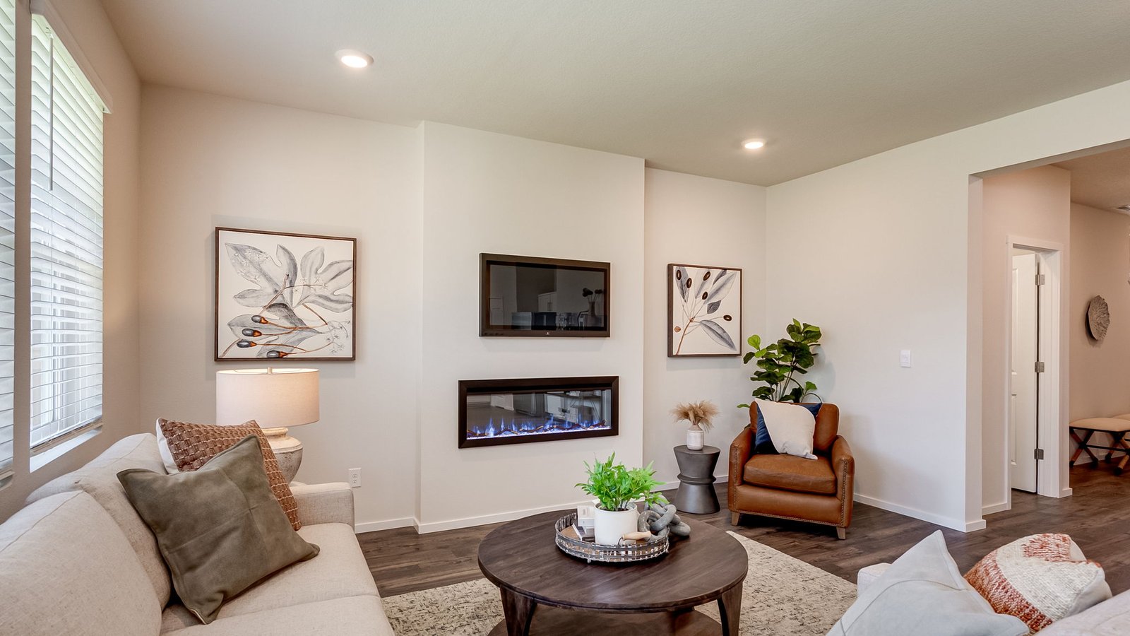 Great room with laminate flooring and an electric fireplace