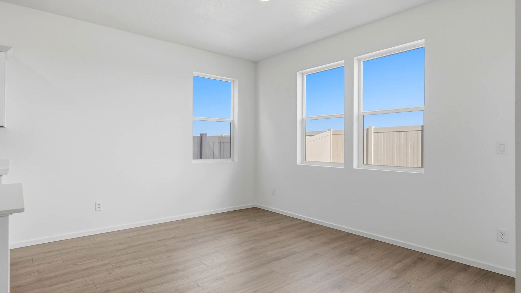 Dining area with a sliding glass door to a fenced backyard