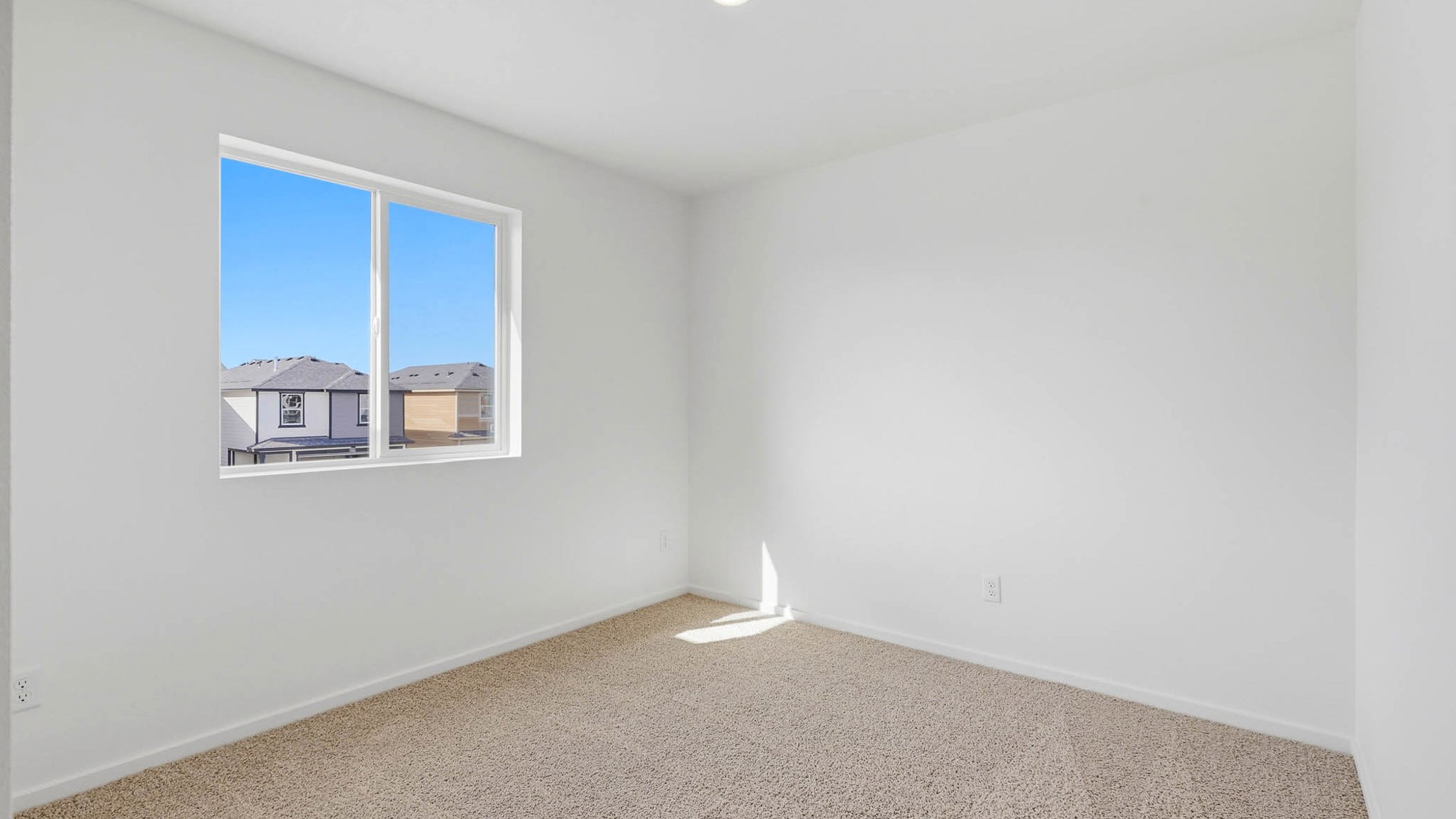 Bedroom with wall-to-wall carpet and a closet