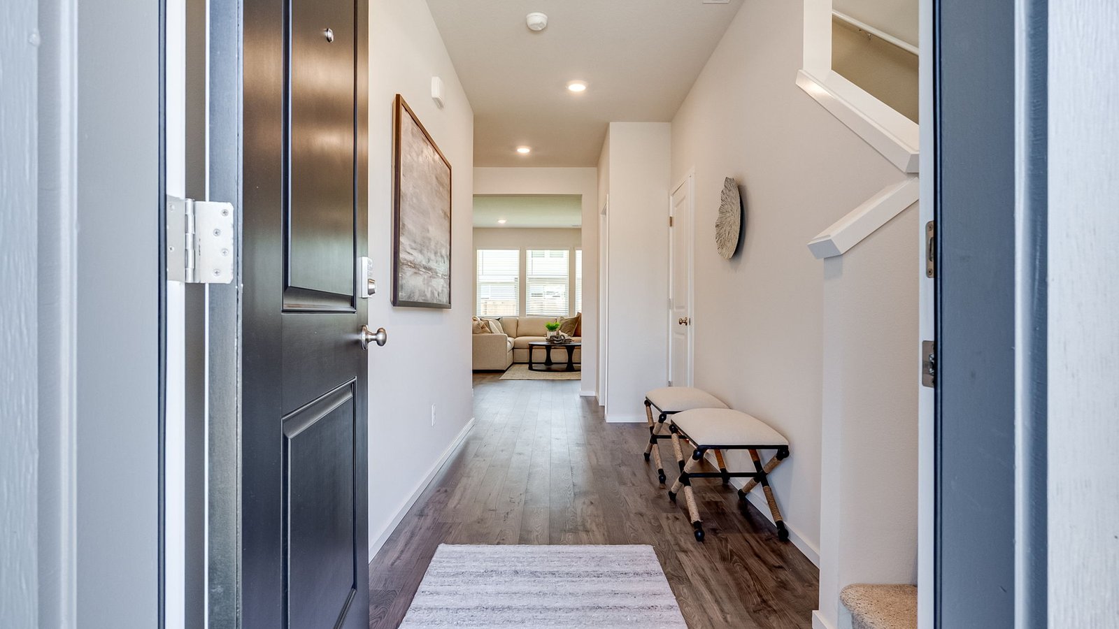 Entryway with a coat closet and laminate flooring