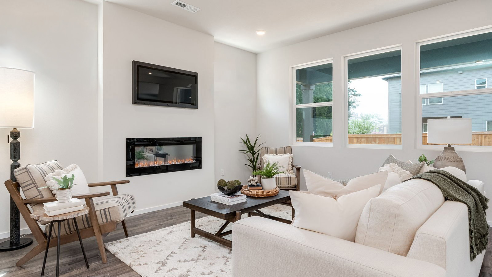 Great room with laminate flooring and an electric fireplace