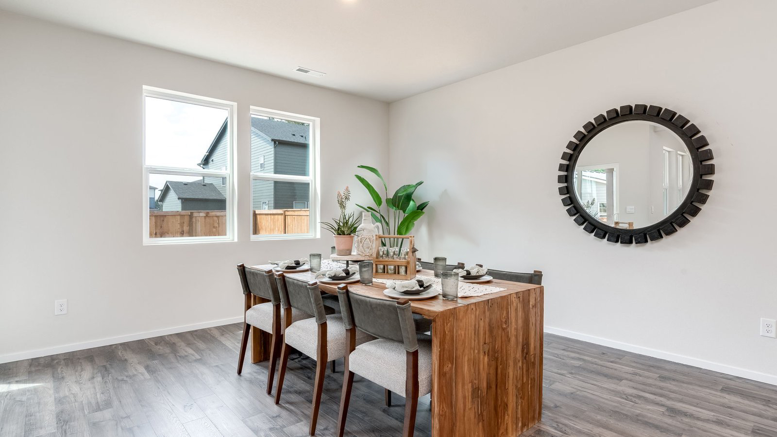 Dining area with a sliding glass door to a fenced backyard