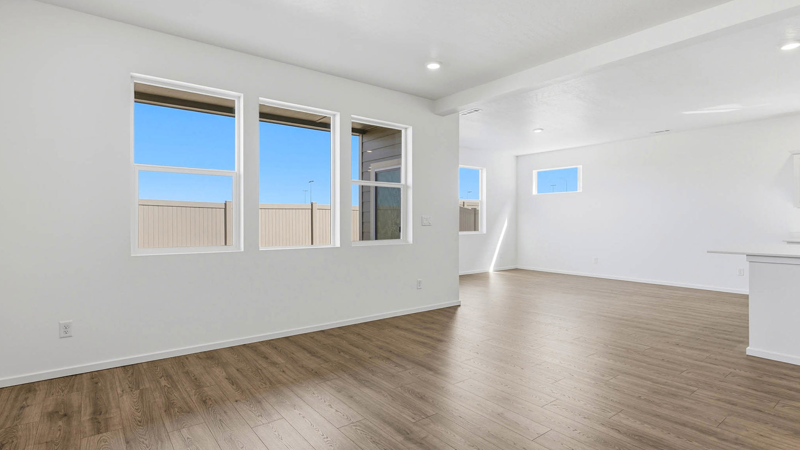Great room with laminate flooring and an electric fireplace