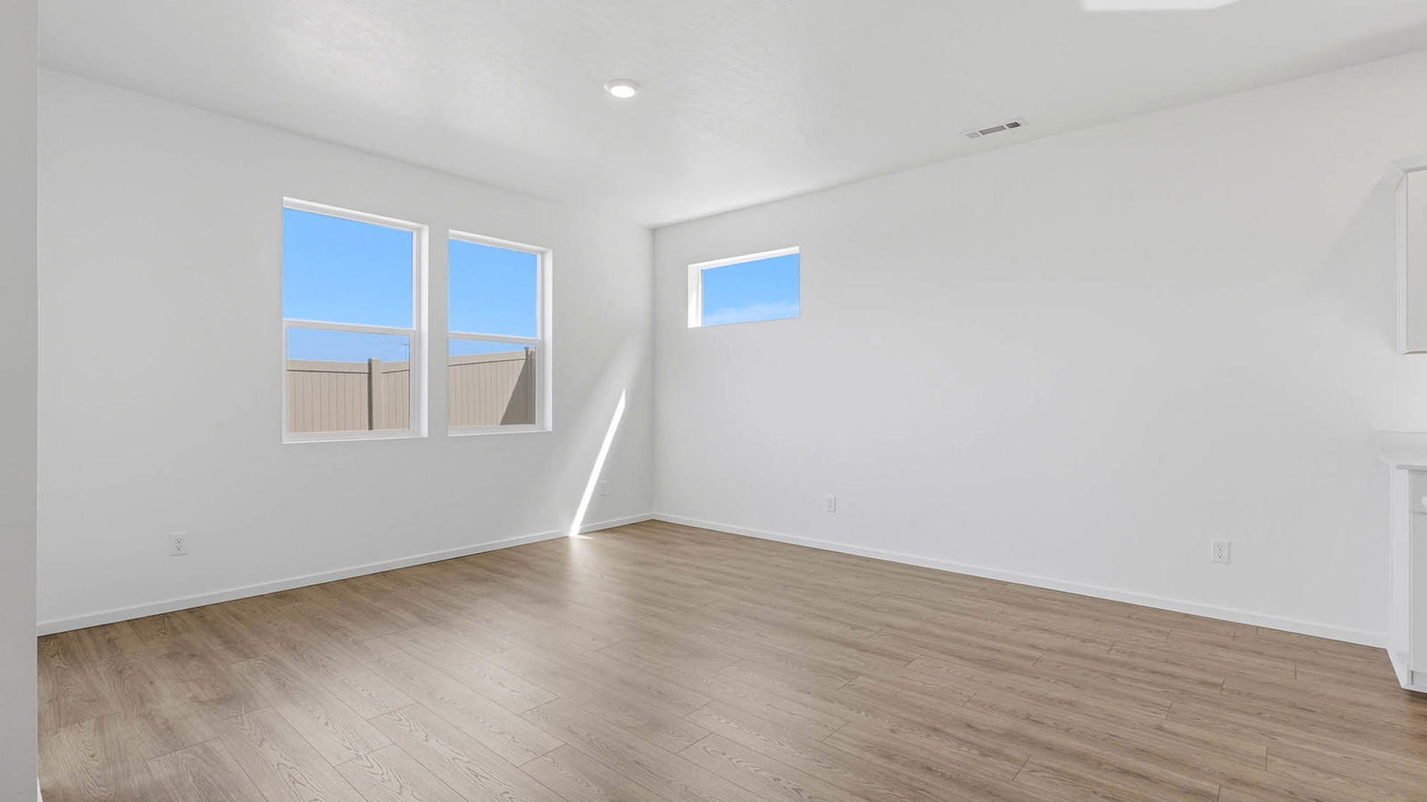 Dining area with a sliding glass door to a fenced backyard