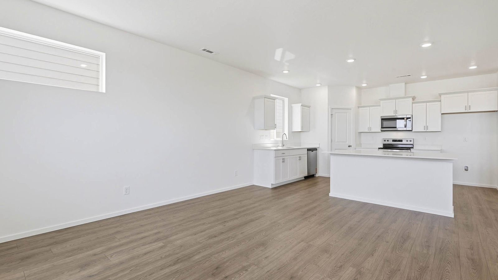 Dining area with a sliding glass door to a fenced backyard