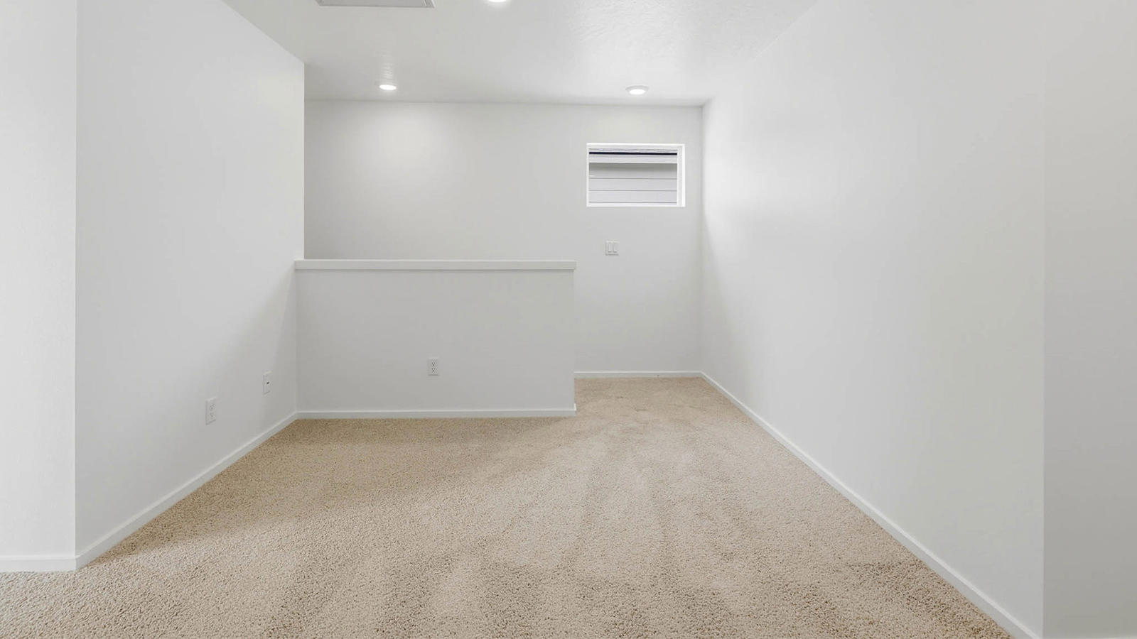 Hallway with wall-to-wall carpet
