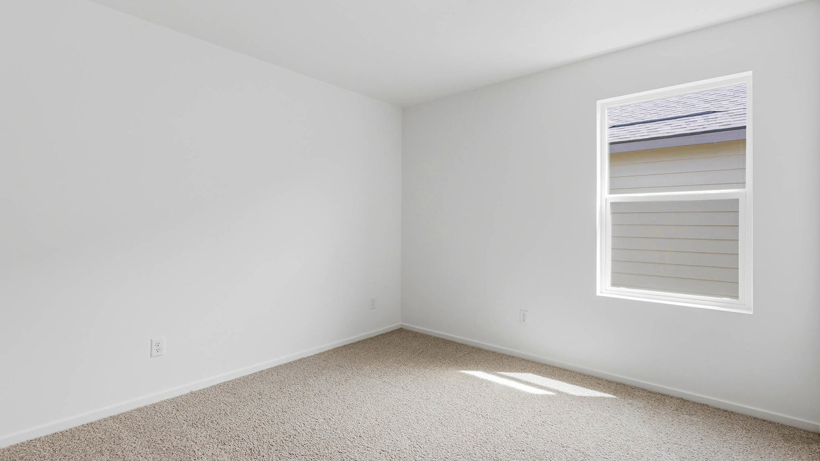 Bedroom with wall-to-wall carpet and a closet